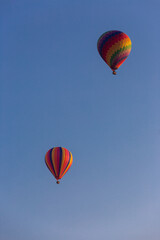 Two Hot Air Balloons against blue sky