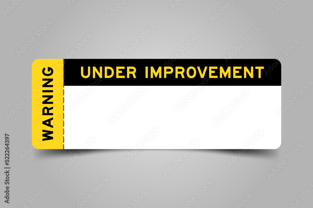 Sticker Yellow and black color ticket with word under improvement warning and  and have white copy psace on gray background