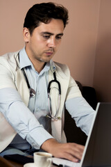 Male doctor using laptop computer with white mockup screen technology tele medicine healthcare e...