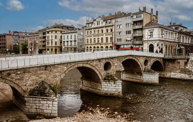 Sarajevo, Bosnia - May 2, 2022 - Library building was the City Hall before The War, and the Latin Bridge.