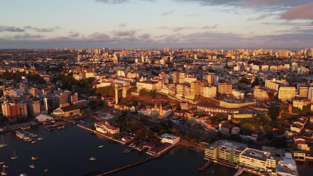Amazing aerial cinematographic image with orange light of the drone dusk of the capital Salvador in Bahia in coastal metropole