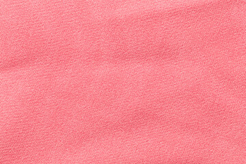 The Clothing Pink color fabric texture background, top view of cloth textile surface