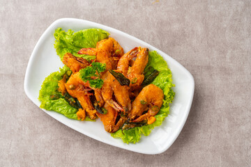 udang saus telur asin or Salted egg fried shrimp with curry leaves