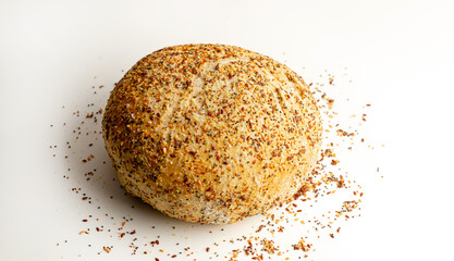 Fresh Multigrain Artisan round Bread or bun with sesame and flax seeds Isolated on White Background. Flat lay. Food concept.