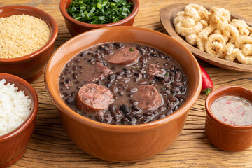Typical brazilian feijoada with rice, kale, farofa and cracklings