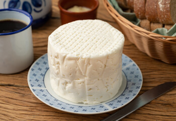 Artisanal fresh white cheese from Minas Gerais, Brazil with coffee and bread