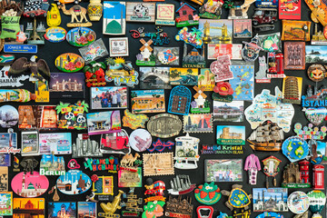 Fridge magnets from trips all around the world - obrazy, fototapety, plakaty