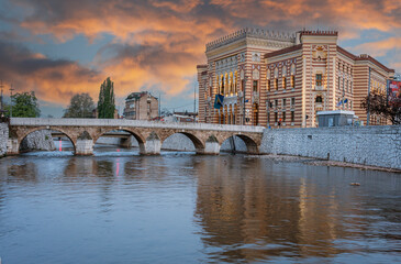Sarajevo, Bosnia - May 2, 2022 - Library building was the City Hall before The War, and the Latin Bridge. © mindstorm