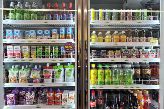 PENANG, MALAYSIA - 9 AUG 2022: Huge fridge with various choice foods and beverages in CU Convenience Store. CU is a South Korean convenience store chain that is operated and owned by BGF Retail.
