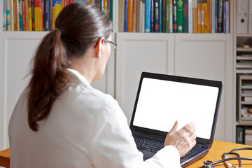 Telemedicine concept: doctor or pharmacist with headset during a video consult with a patient with...