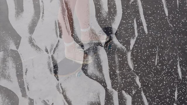 Animation of scratches over legs of caucasian boy on skateboard