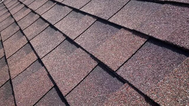 Close shot of bituminous tiles roofing on very hot