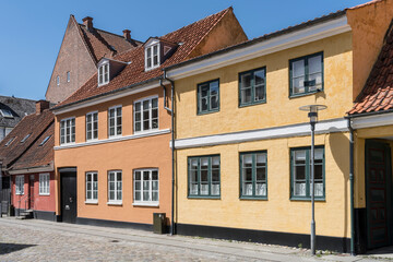 street with traditional houses on cobbled pavement, Koge, Denmark