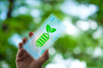 Mobile phone battery icon full of energy from nature. Renewable energy