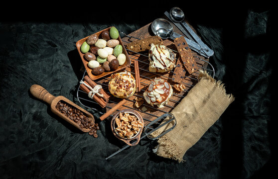 Chocobon Bun Topped With Rich Cream Cheese Frosting, Caramel Pecan Cinnamon Roll Topped With Decadent Caramel Frosting And Pecans And Thai Milk Tea Almond Minibon With Ingredients On Dark Background. 