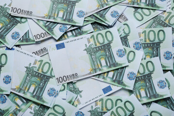 Obraz na płótnie Canvas 100 Euro banknotes as background, top view. Money exchange