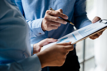 Close up of hands are working and brainstorming on paperworks about business financial and marketing.