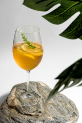 cold tea with lemon and ice in a glass