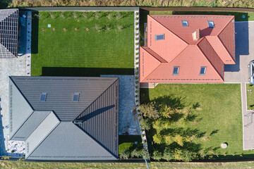 Aerial view of residential house with backyard in suburban rural area