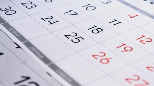 Calendar pages flipping close up