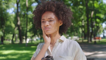Young woman drinking coffee, feeling pain, teeth sensitivity, dental problem