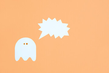 Trendy halloween design, white cute ghost with a shouting blank speech bubble on pastel orange...