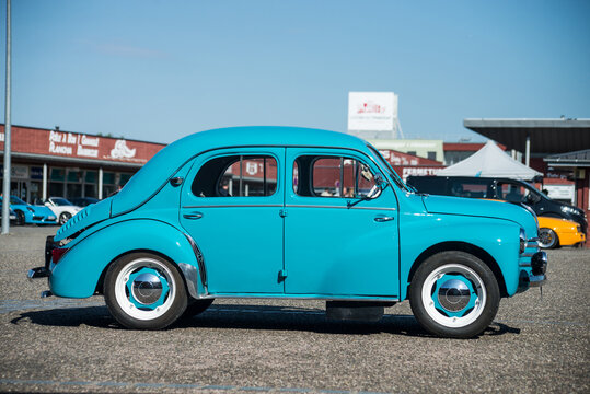 Lutterbach - France - 7 August 2022 - Profile view of blue Renault 4cv 1956, the famous vintage car  parked in the street