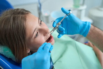 Teenage patient receiving anesthesia before dental procedure