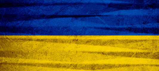 Ukrainian flag background banner panorama - Old rustic damaged concrete stone wall texture background, painted in the colors of the flag of Ukraine....