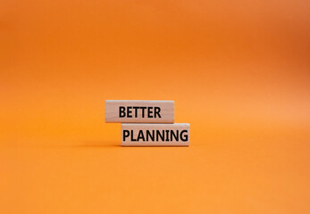 Better planning symbol. Concept word Better planning on wooden blocks. Beautiful orange background. Business and Better planning concept. Copy space