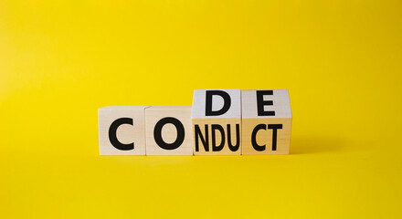 Code of conduct symbol. Turned cubes with words Conduct abd Code. Beautiful yellow background. Business and Code of conduct concept. Copy space