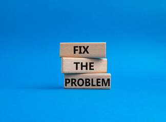 Fix the problem symbol. Wooden blocks with words Fix the problem. Beautiful blue background. Business and Fix the problem concept. Copy space.