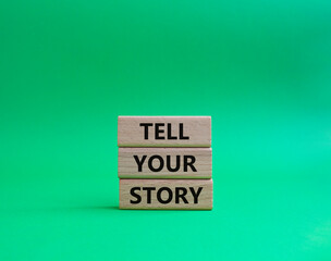 Tell your story symbol. Wooden blocks with words Tell your story. Beautiful green background. Business and Tell your story concept. Copy space.