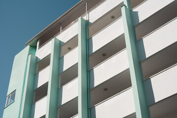 New residential apartment building with large balconies.