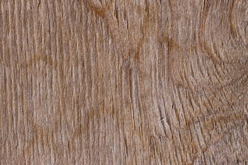 Texture of old plywood. Weathered rough surface of a wooden Board. Brown wood background.