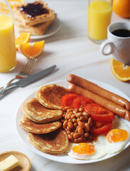 Traditional British breakfast with sausages and beans	