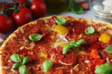 Pizza with salami and basil
