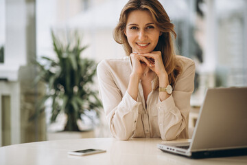 Portrait of a business woman working on laptop