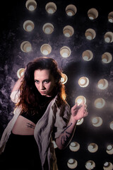 Sexy girl dance on front of spot light wall with smoke