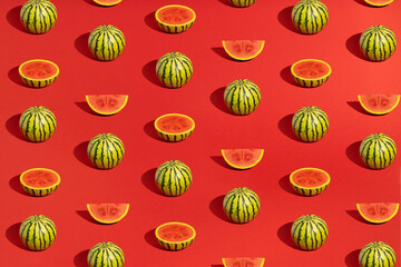Pattern of differently cut samples watermelon on red background. Summer minimal concept