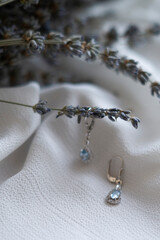 blue earrings with kyanite stones on a lavender background