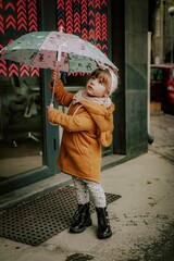 little girl with umbrella goes in the center from varna bulgaria 