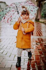 little girl with umbrella goes in the center from varna bulgaria 