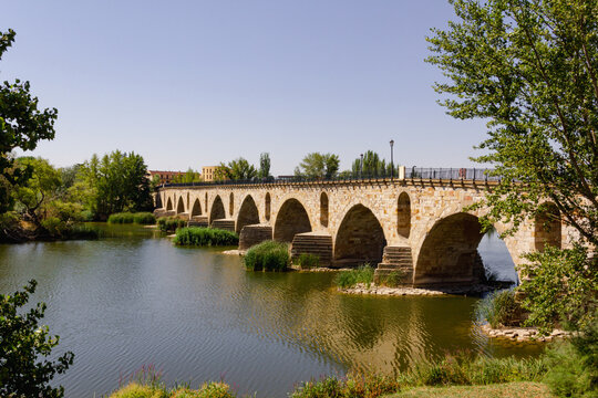 Stone bridge over the Duero river in Zamora, Spain. Copy space. Selective focus.