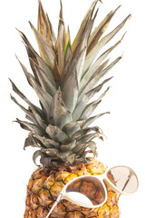 Pineapple wearing sunglasses. Summertime vacation holiday eating healthy concept.