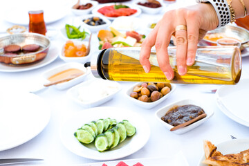 Turkish breakfast is served with olive oil on cucumber