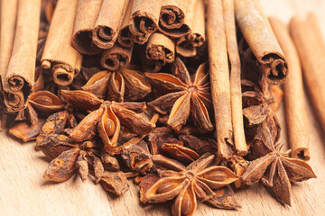 Cinnamon sticks and anise star on a wooden background
