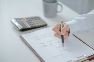 Fototapeta premium Asian business woman Hand writing ideas And taking notes