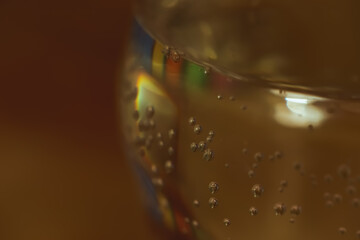 small bubbles on full champagne glass wall happy new year warm