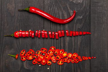 hot chili peppers chopped on a wooden table top view